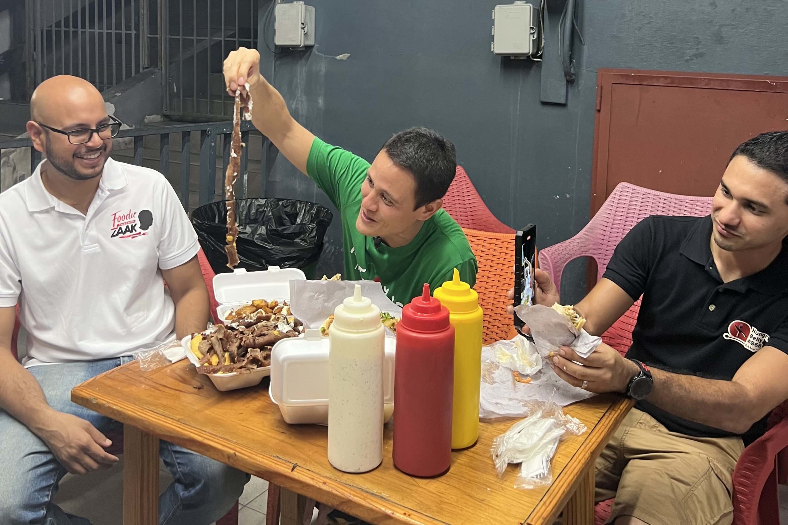 Mark Wiens, Foodies Tales with Zaak and Hungry Belly 868 eating gyros on Ariapita Avenue in Port of Spain on a street food in Trinidad and Tobago