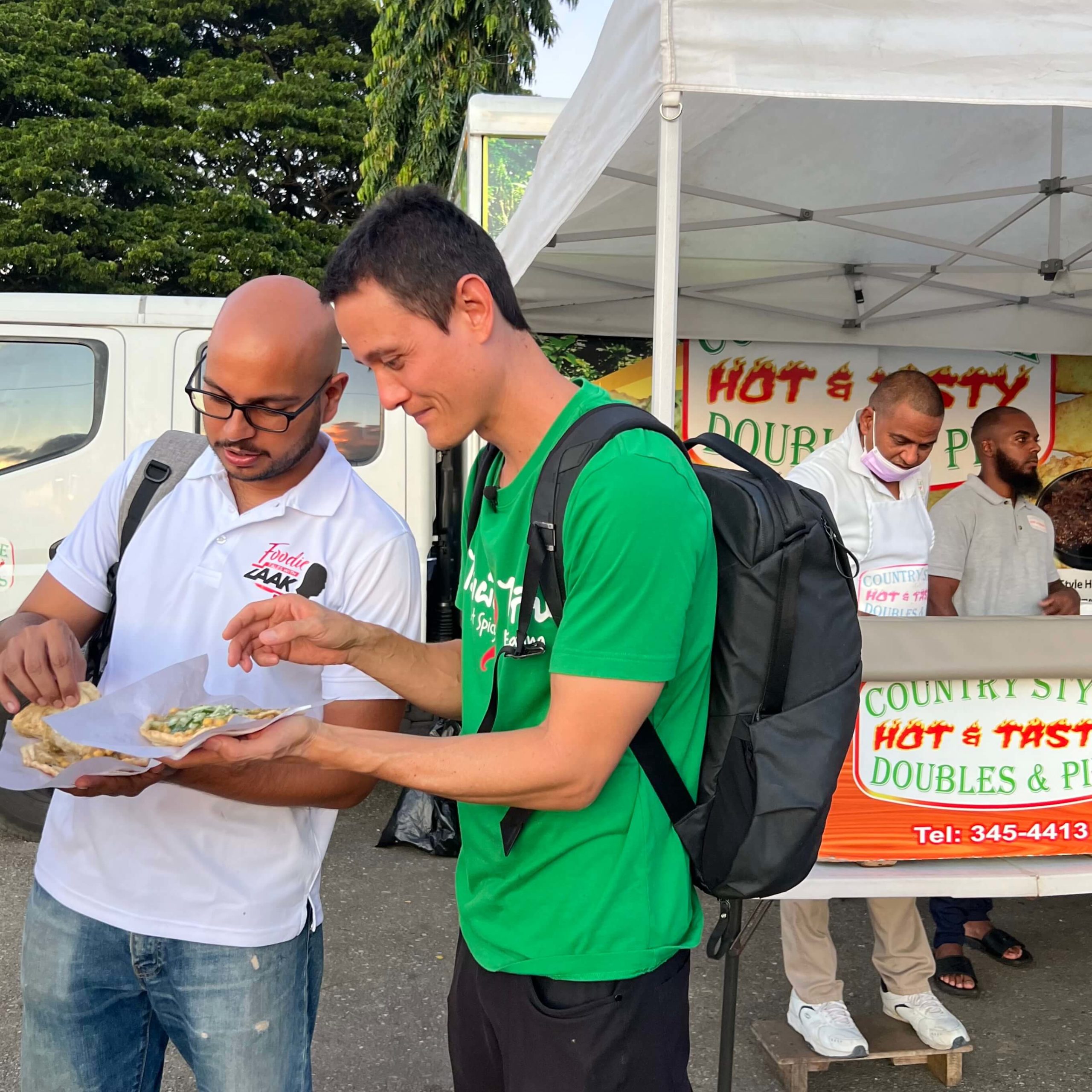 Mark Wiens and Foodie Tales with Zaak eating doubles in Port of Spain Trinidad, on a street food tour